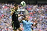 Chelsea's Cesar Azpilicueta (L) and Man City's Carlos Tevez are pictured during their FA Cup match on April 14, 2013